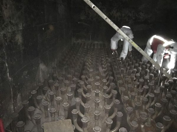 Inspecting a fluidized bed of an industrial boiler