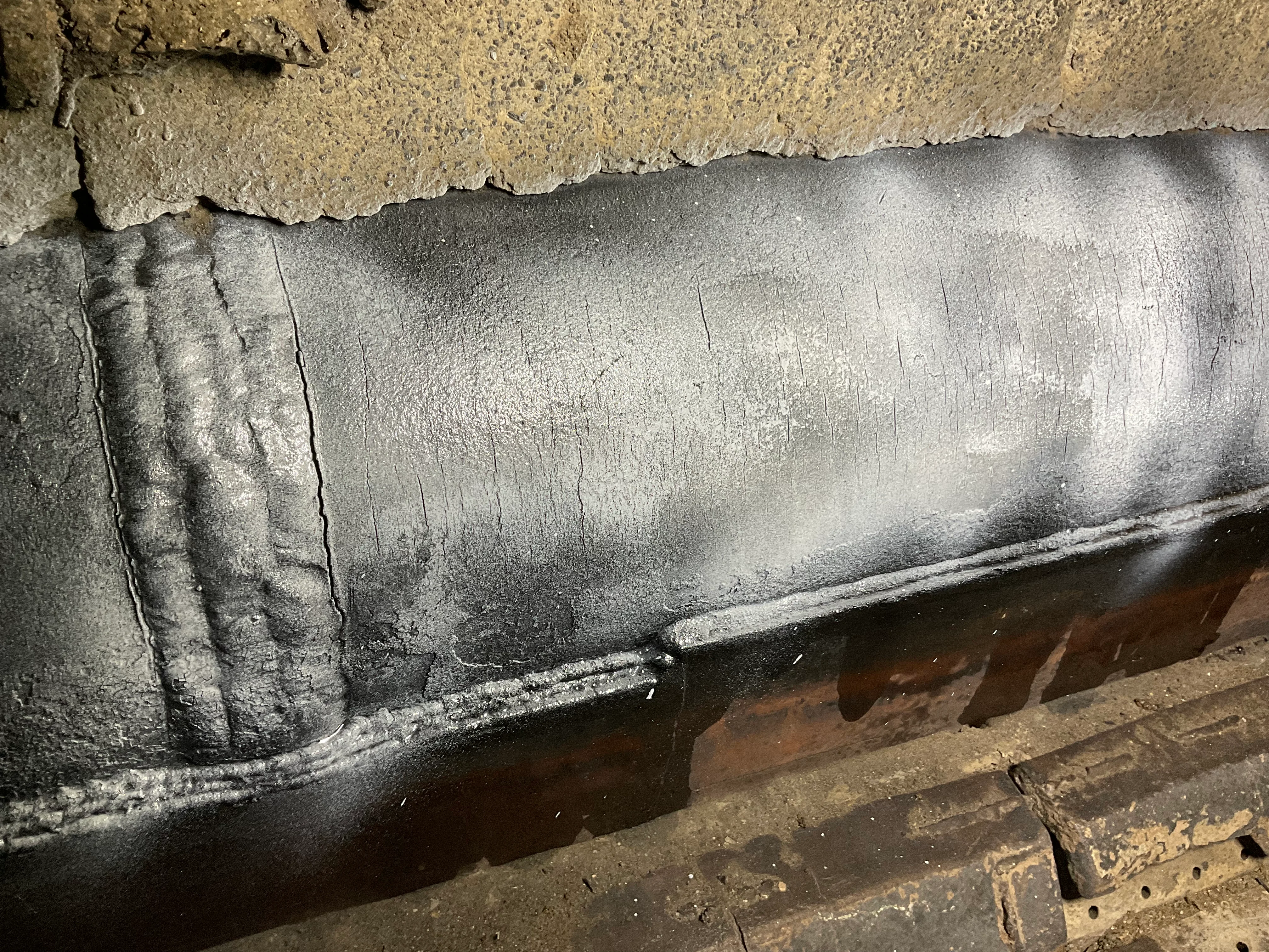 Cracking on the fire-facing surface of a furnace lower sidewall header